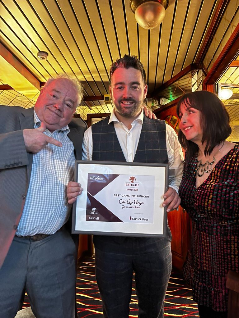 Cai Ap Bryn holding his Eat Game Awards Best Game Influencer certificate
