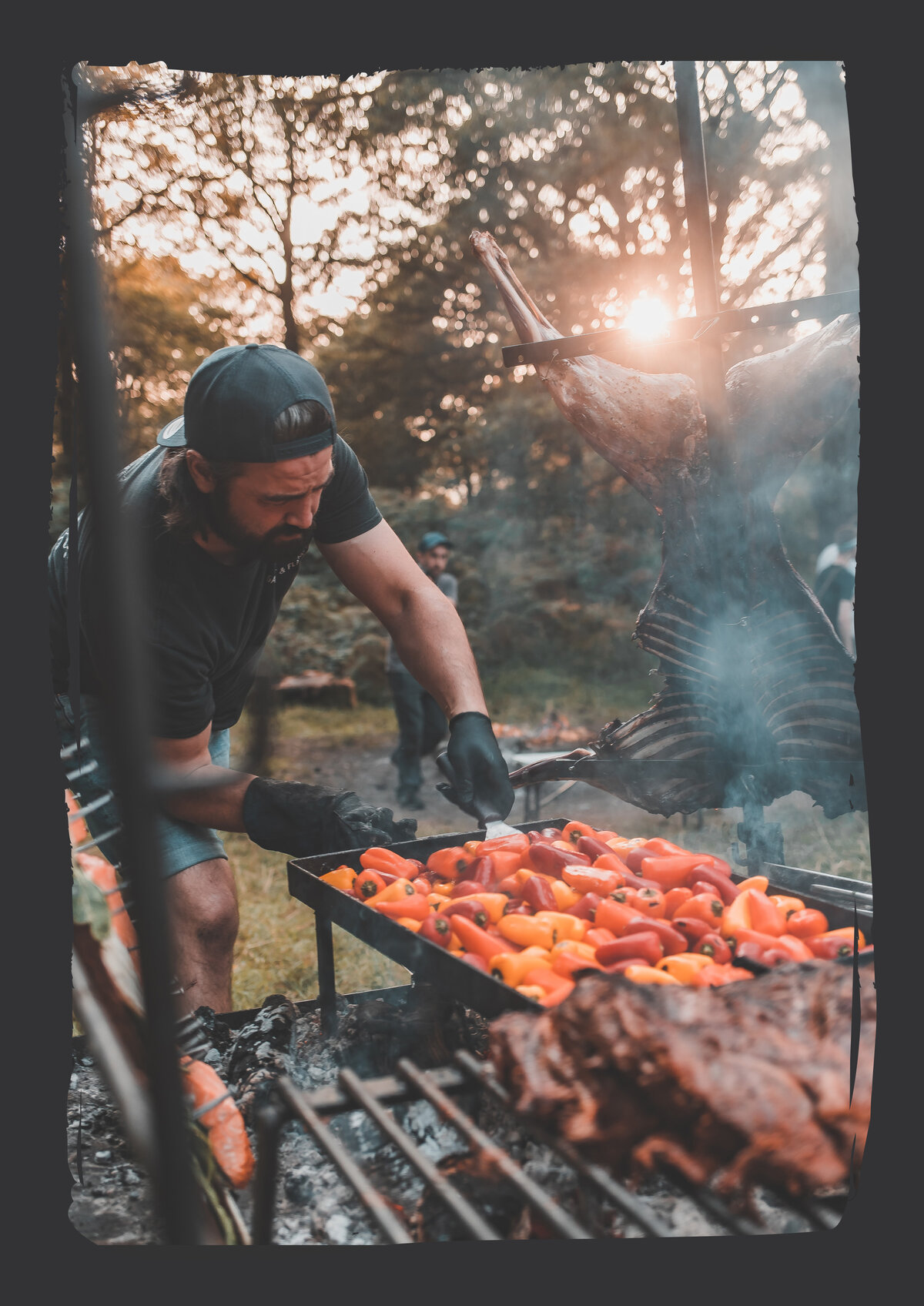 Chef Cai Ap Bryn fire-grilling at sunset