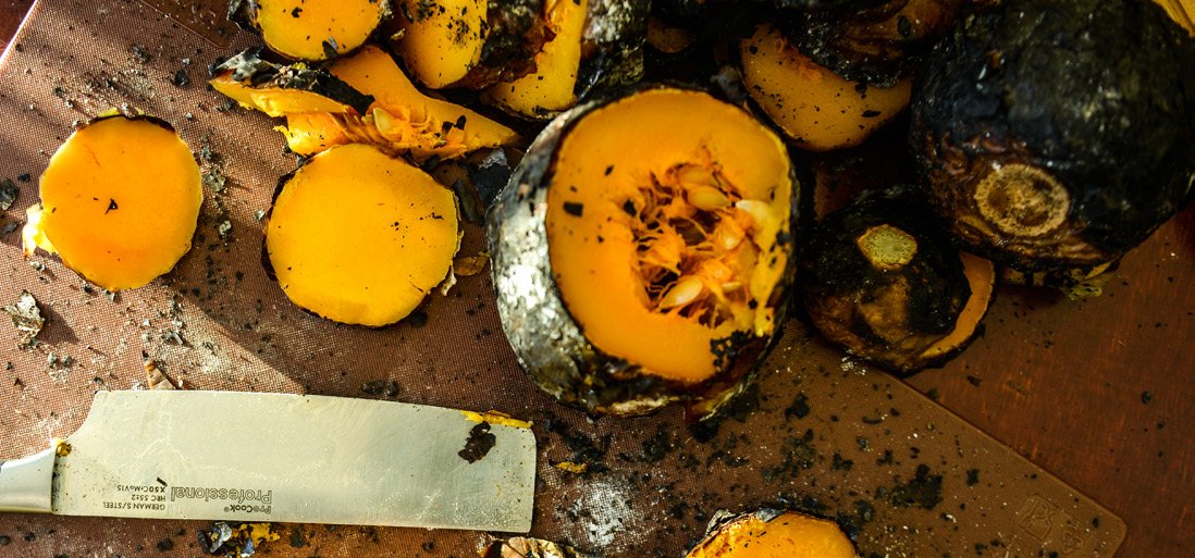 Ember-baked squash on cutting board